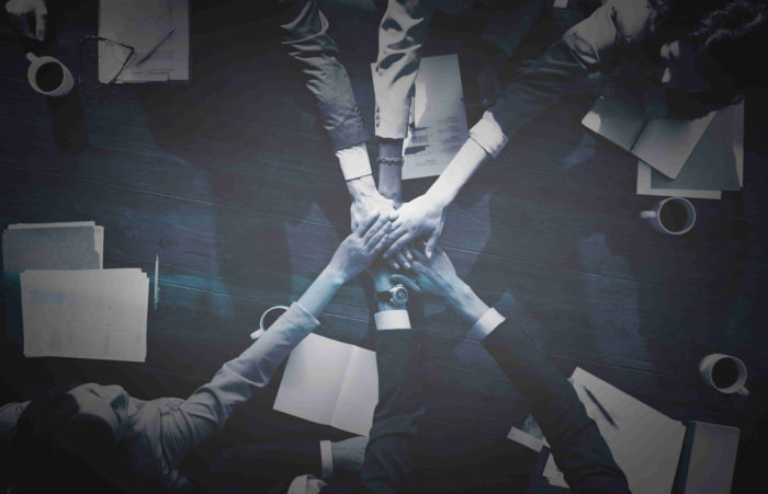 Business people stacking their hands Human Resources